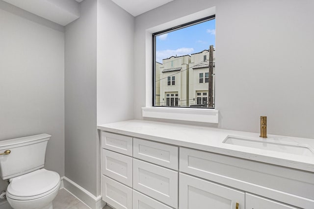 bathroom featuring toilet and vanity