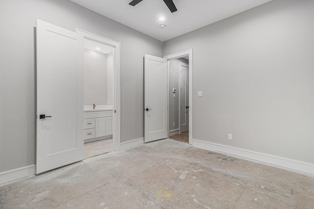 unfurnished bedroom featuring ensuite bath and ceiling fan