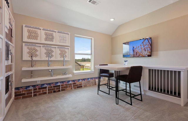 office area featuring carpet floors and lofted ceiling