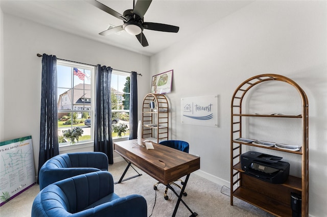 home office featuring ceiling fan and light colored carpet