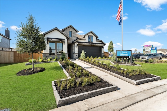 view of front of house with a front lawn and a garage