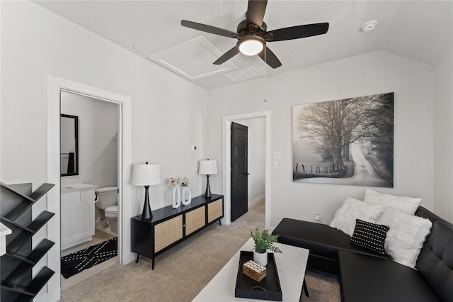 living room with light carpet, ceiling fan, and vaulted ceiling