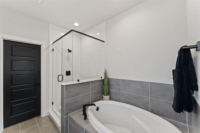 bathroom featuring plus walk in shower and tile patterned floors