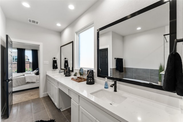 bathroom with tile patterned flooring and vanity