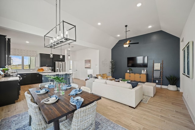 dining area featuring ceiling fan and lofted ceiling