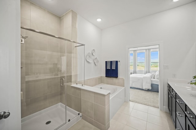 bathroom with vanity, separate shower and tub, and tile patterned floors