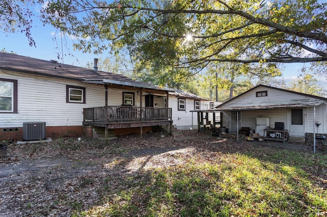 back of property featuring cooling unit and a deck