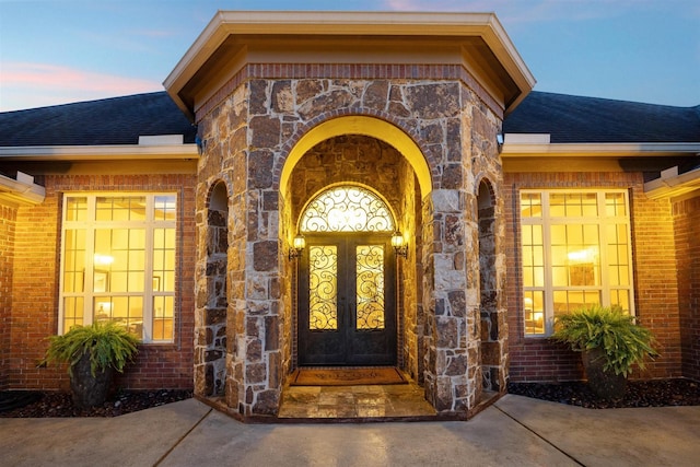 exterior entry at dusk with french doors