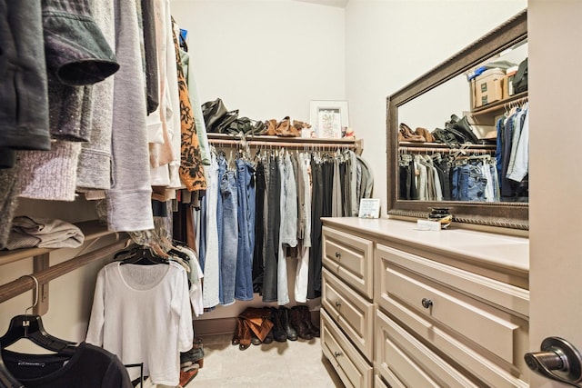 spacious closet featuring light tile patterned flooring