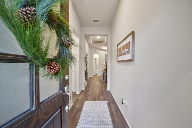 hall with dark hardwood / wood-style floors