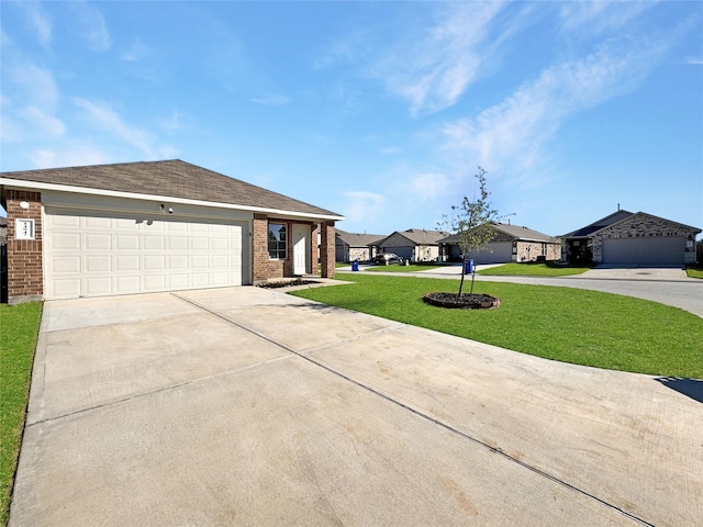 single story home with a garage and a front lawn