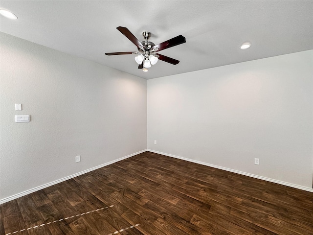 unfurnished room featuring ceiling fan and dark hardwood / wood-style flooring