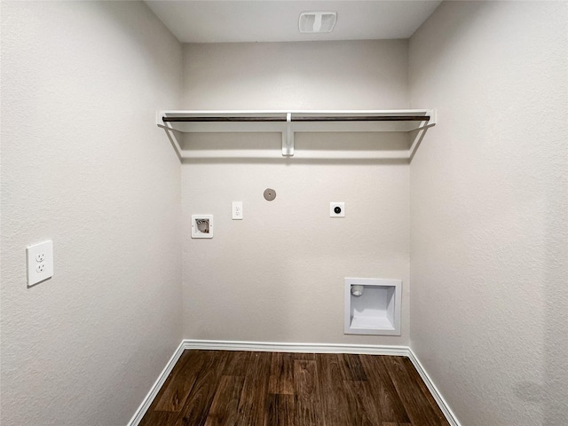 clothes washing area with electric dryer hookup, hookup for a gas dryer, washer hookup, and hardwood / wood-style flooring