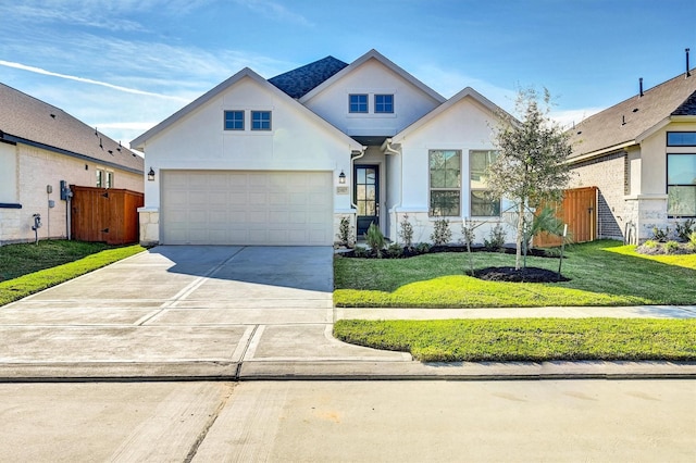 view of front facade featuring a front lawn and a garage