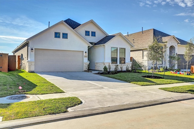 view of front of house featuring a garage and a front lawn