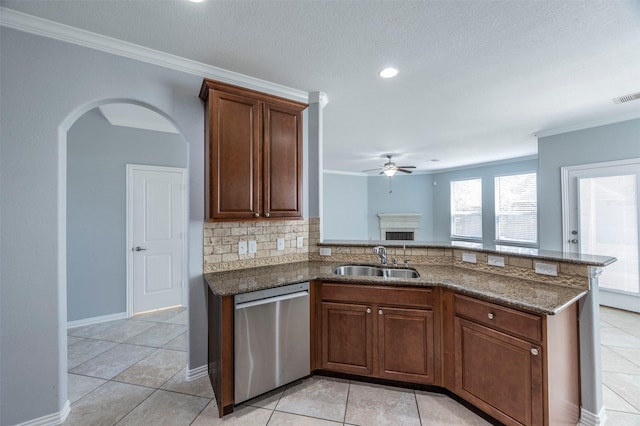 kitchen with ceiling fan, dishwasher, sink, backsplash, and crown molding