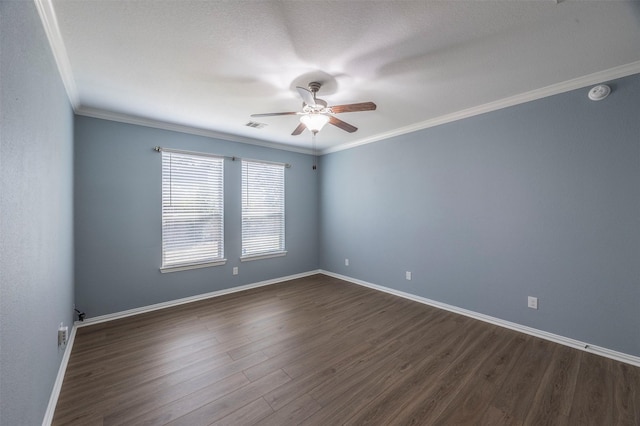 spare room with a textured ceiling, crown molding, ceiling fan, and dark wood-type flooring