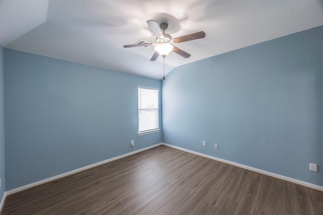 empty room featuring ceiling fan, wood-type flooring, and lofted ceiling