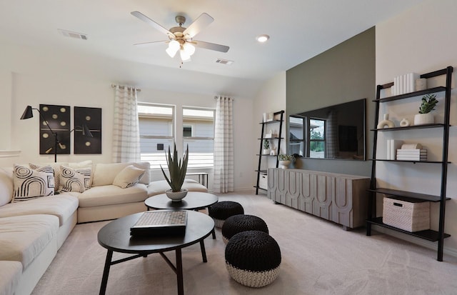 carpeted living room featuring vaulted ceiling and ceiling fan