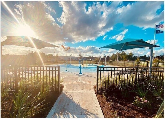 view of swimming pool with tennis court