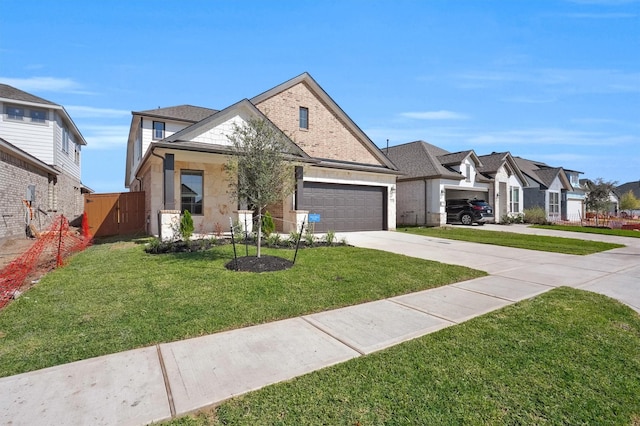 view of front of house featuring a front yard and a garage