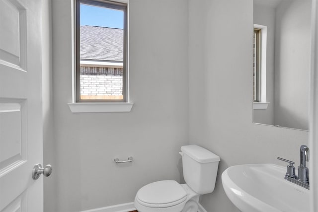 bathroom featuring sink and toilet