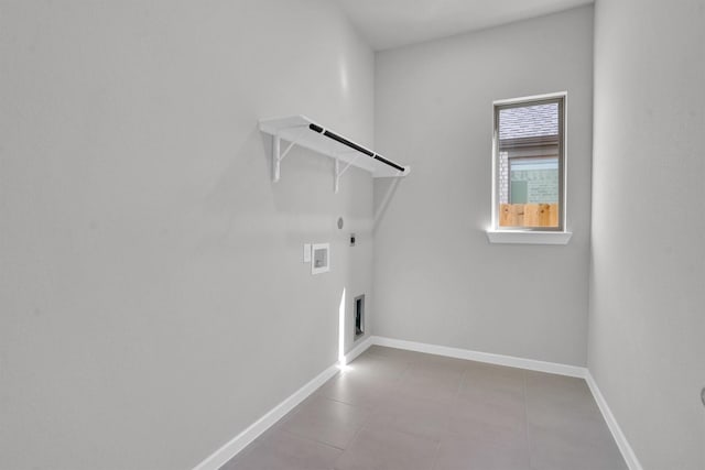 clothes washing area with hookup for a gas dryer, washer hookup, and hookup for an electric dryer