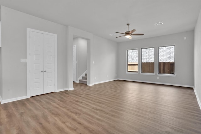 interior space with ceiling fan and hardwood / wood-style flooring