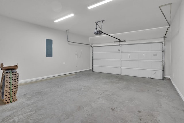 garage featuring electric panel and a garage door opener