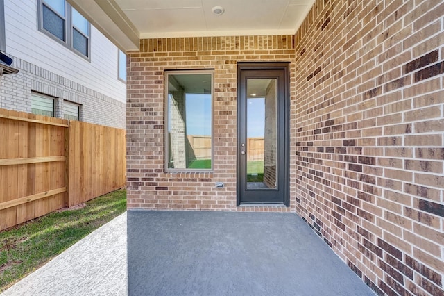 entrance to property with a patio