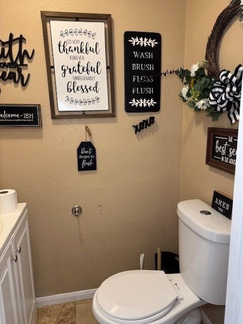 bathroom with tile patterned floors, vanity, and toilet