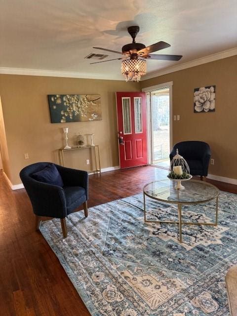 living room featuring crown molding, dark hardwood / wood-style flooring, and ceiling fan