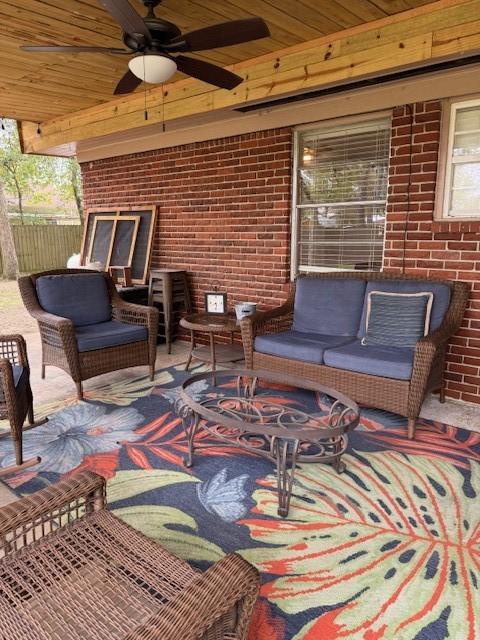 view of patio featuring an outdoor living space and ceiling fan