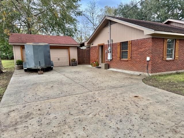 view of side of home with a garage