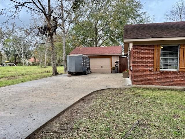 view of property exterior with a yard and a garage