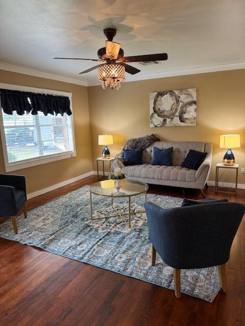 living room with hardwood / wood-style floors, ceiling fan, and ornamental molding