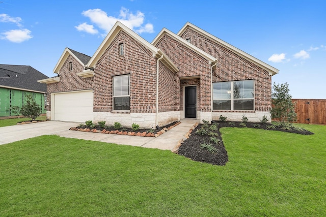 view of front facade with a front yard and a garage