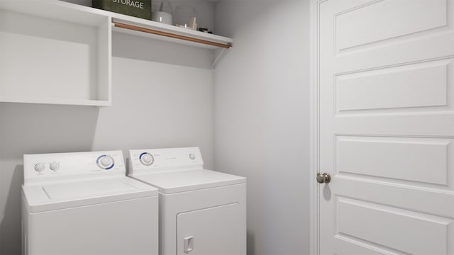 clothes washing area featuring washing machine and clothes dryer