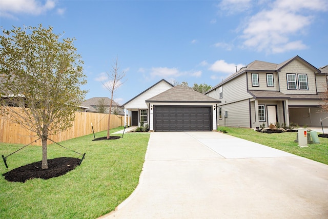 view of front of property featuring a garage and a front lawn