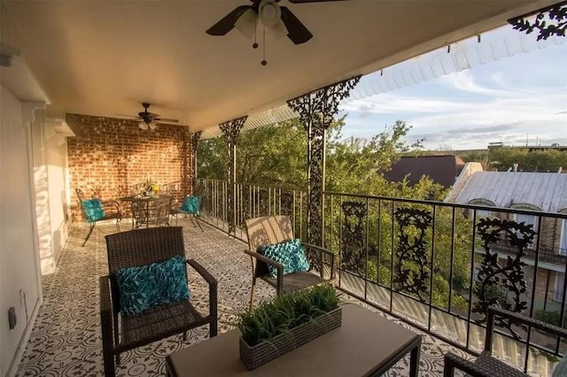 balcony with ceiling fan and an outdoor living space