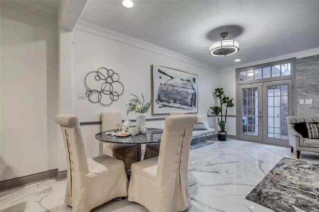 dining space with french doors and ornamental molding