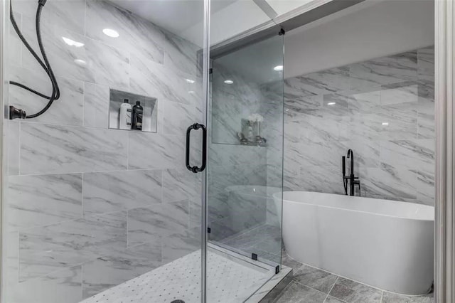 bathroom with separate shower and tub