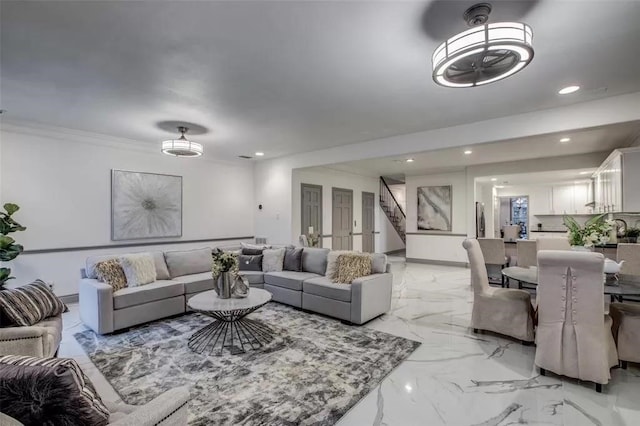 living room featuring crown molding and sink