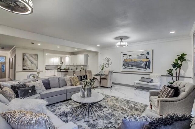 living room with ornamental molding