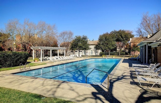 view of swimming pool with a pergola and a patio