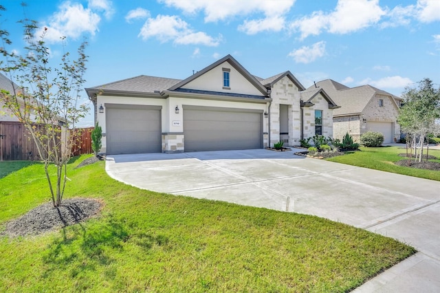 view of front of house featuring a front yard and a garage