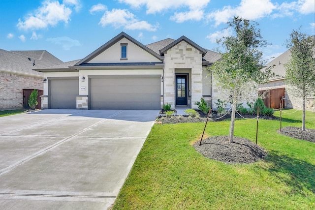 view of front of home with a front lawn and a garage