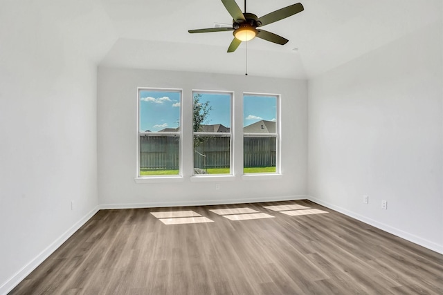 unfurnished room featuring hardwood / wood-style flooring, ceiling fan, and lofted ceiling