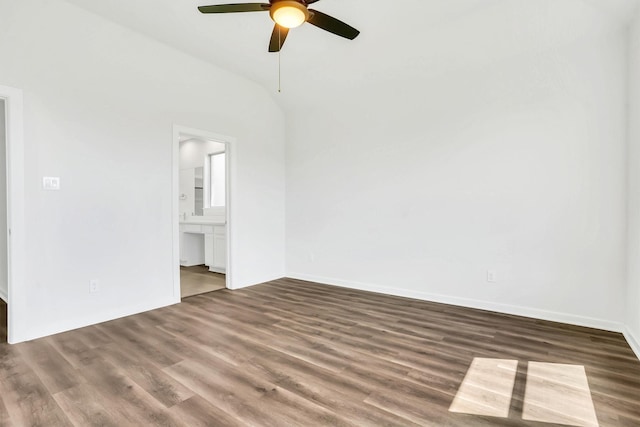 spare room with dark hardwood / wood-style floors, ceiling fan, and high vaulted ceiling