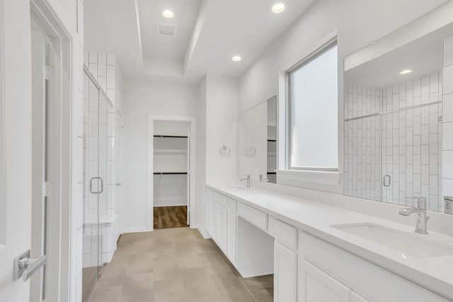 bathroom with vanity, tile patterned floors, and a shower with shower door